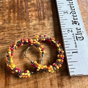 multi color beaded hoop gold tone earrings